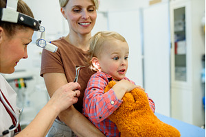 Otolaryngologist examining toddler, a Health & Medical Photo by HalfPoint