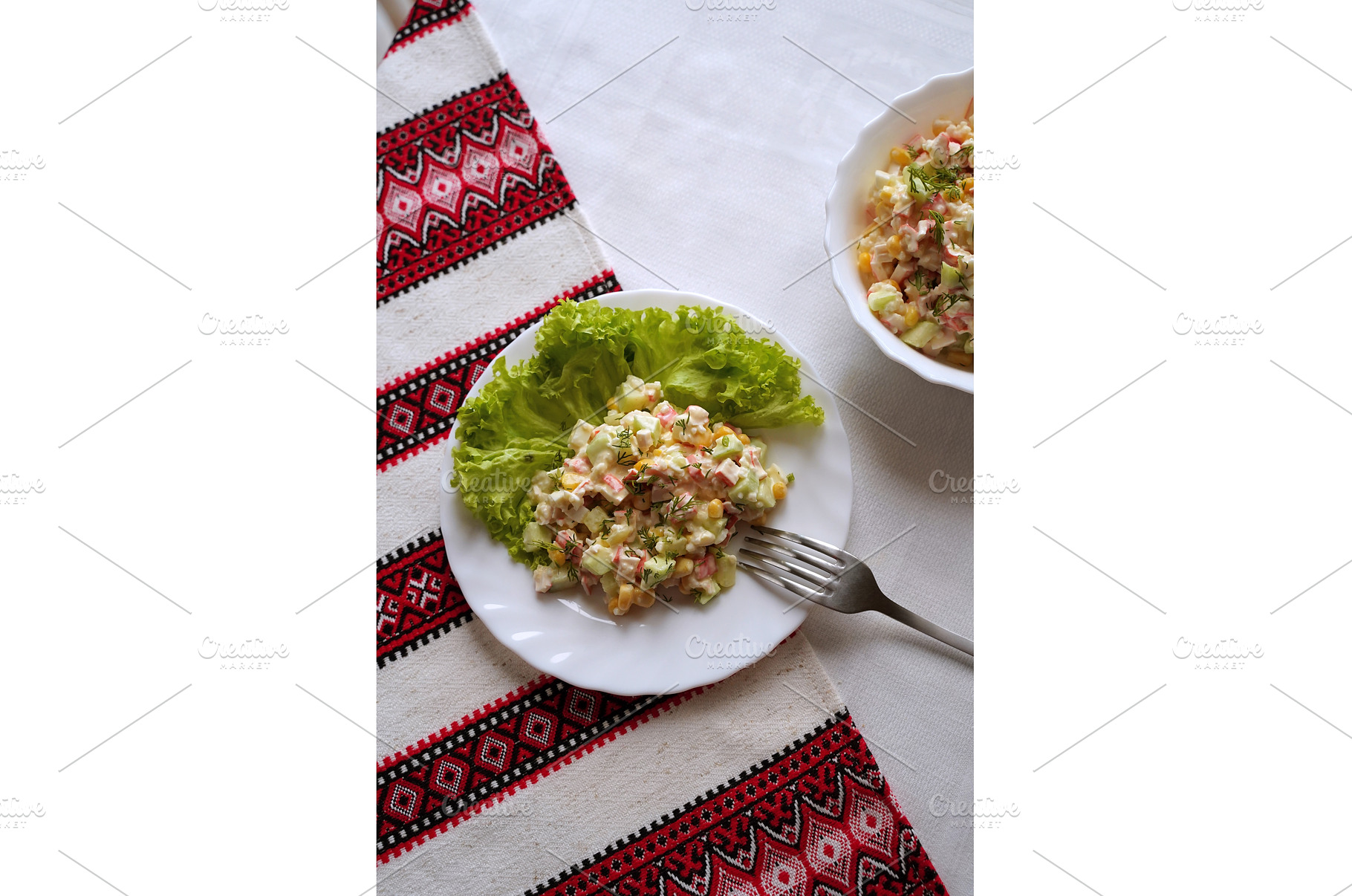 Homemade crab stick salad typical of, a Food & Drink Photo by Oleksandr Berezko