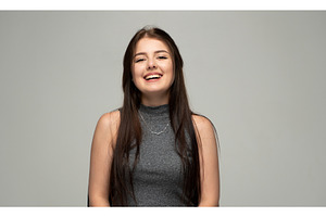 Young woman confidently smiling and, a Person Photo by volodymyrshtun13795