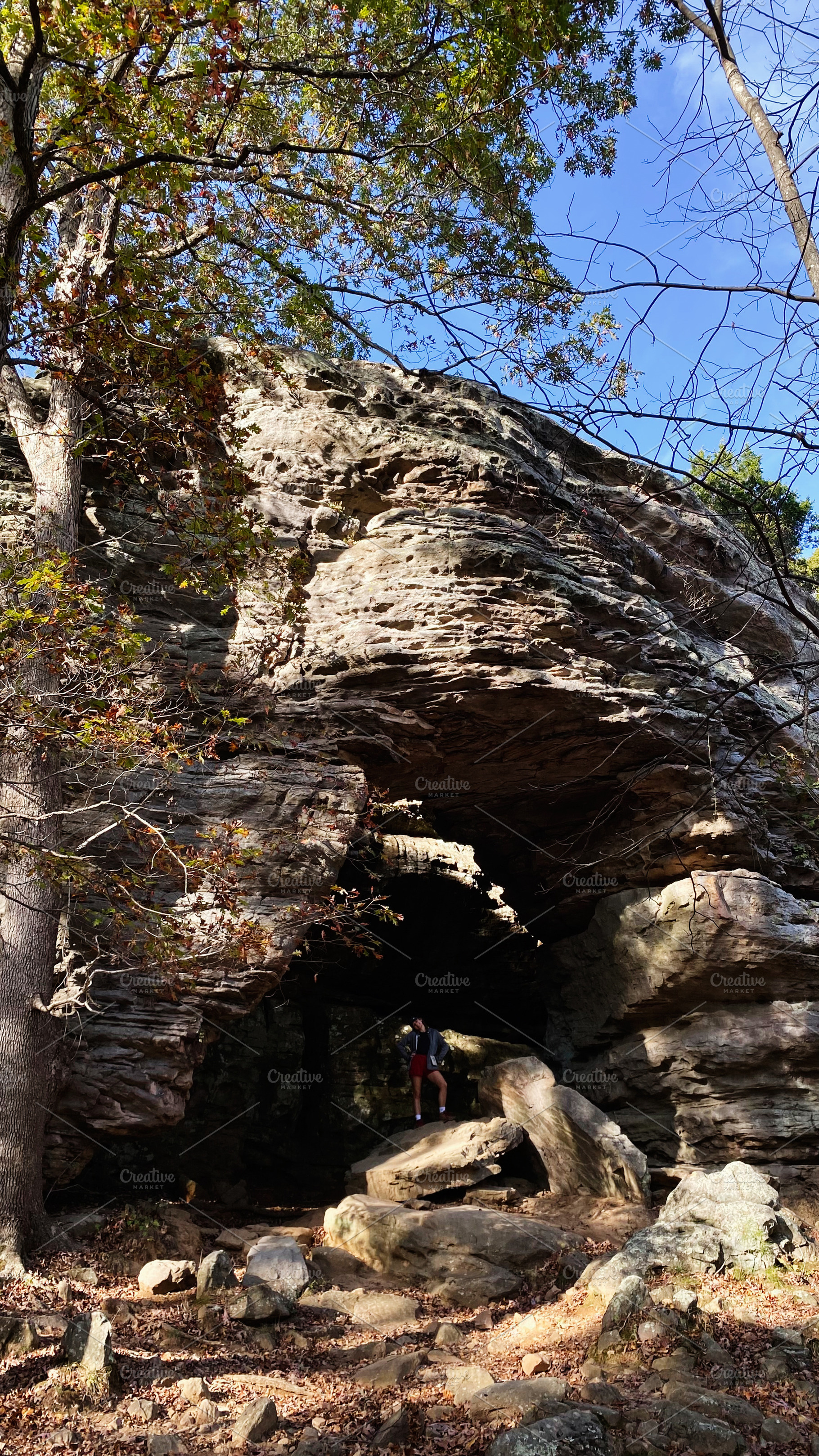 Hiker exploring a rock arch at Garden of the Gods in Colorado Springs, Colorado, a Nature Photo by AS photostudio