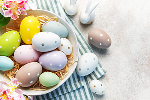 Pastel easter eggs in nest with spring decoration, a Holiday Photo by Olena Rudo