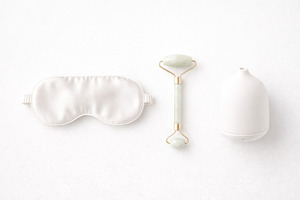 Spa wellness set with an eye mask, jade roller, and diffuser on, a Photo by Dvoevnore photos