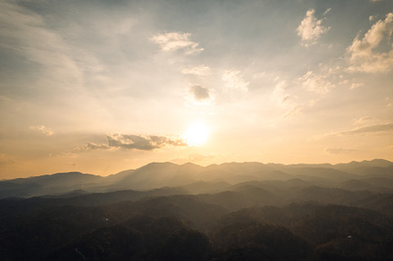 View of mountains and trees in the evening,in the summer, a Nature Photo by Art Rachen