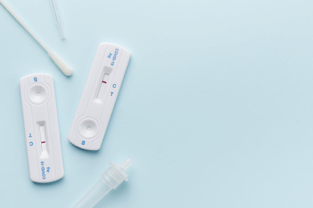 Home testing kit for coronavirus on a blue background, a Health & Medical Photo by Olena Rudo