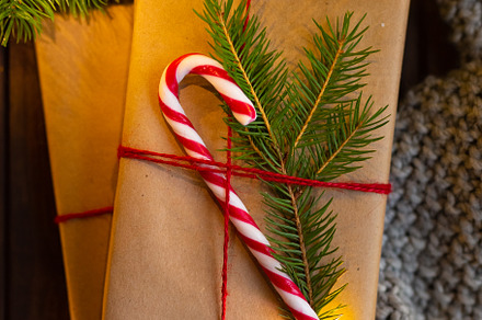 Closeup cozy winter christmas featuring gift, wrapping, and wooden