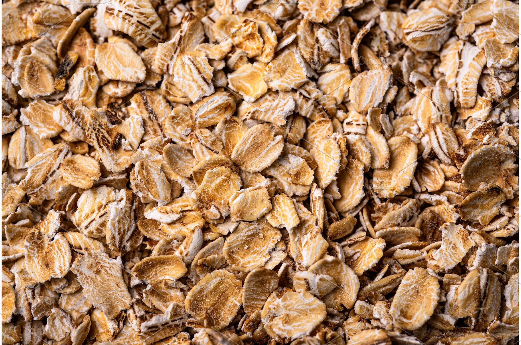 Textured oatmeal grains on white, a Food & Drink Photo by Yulia Furman