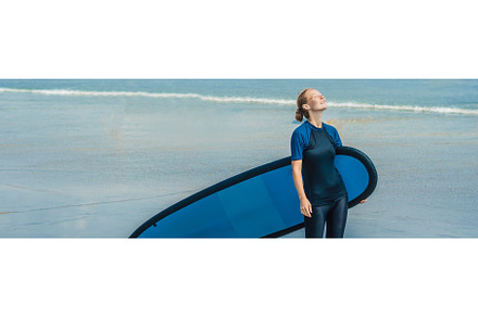 Young woman in swimsuit with surf, a Sports & Recreation Photo by Elizaveta Galitskaya