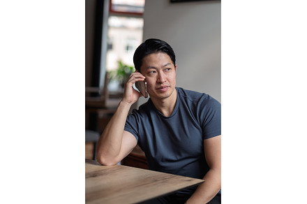 Confident man having phone call at, a Person Photo by HalfPoint