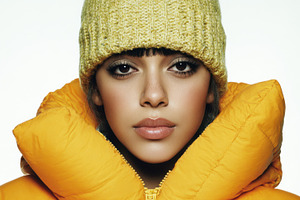 Young woman in yellow coat, a Photo by Beautiful things