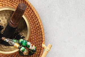 Tibetan Singing Bowl with Wooden Mallet and Beaded Bracelet on W, an Abstract Photo by Natalia Klenova's Shop