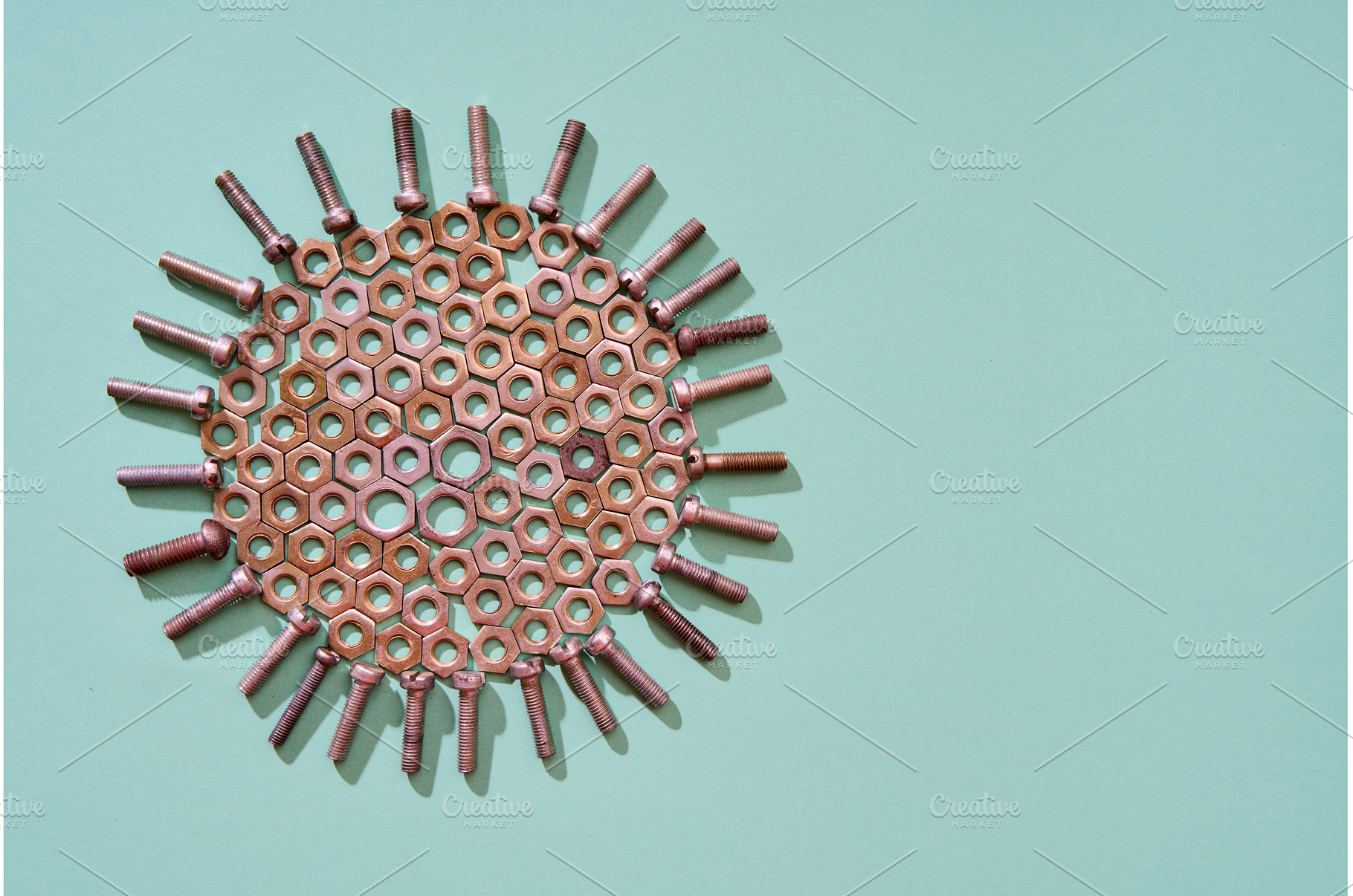 Circular Bolts and nuts pattern with, an Industrial Photo by Gladkov photography