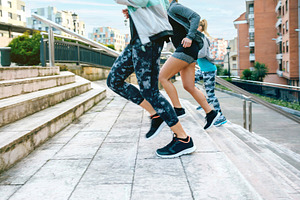 Young women friends training running up stairs in town, a Sports & Recreation Photo by davidpereiras