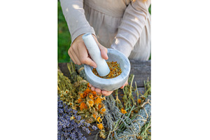 Woman with dried medicinal herbs, a Nature Photo by yanadjana