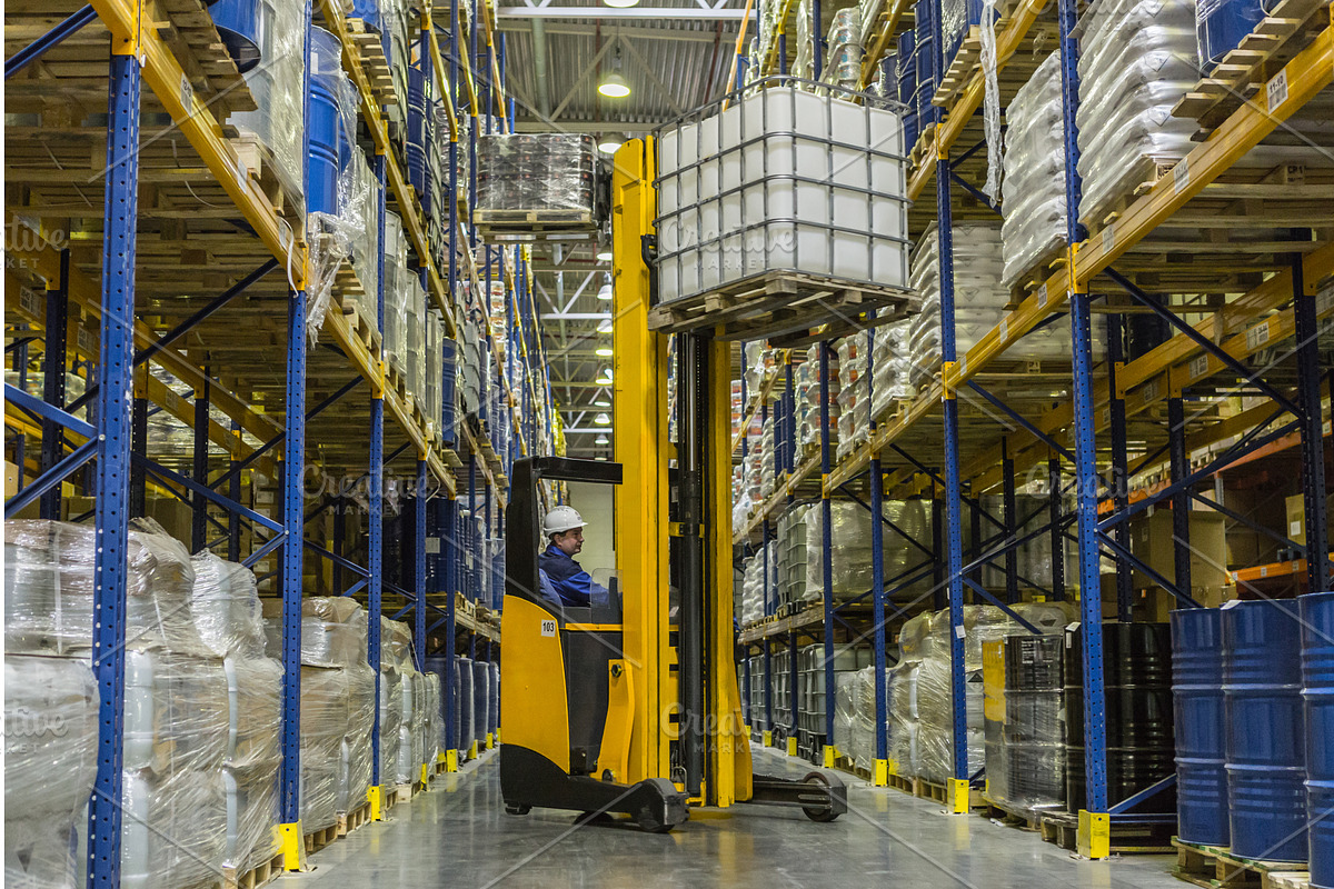 Warehouse worker on stacker taking, a Graphic by a_medvedkov