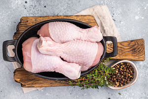 Fresh chicken drumsticks, raw poultry showcasing their rich colo, a Food & Drink Photo by composter-box@mail.ru