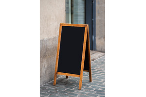 Blank wooden chalkboard a-frame sign, a Business Photo by volodymyrshtun13795