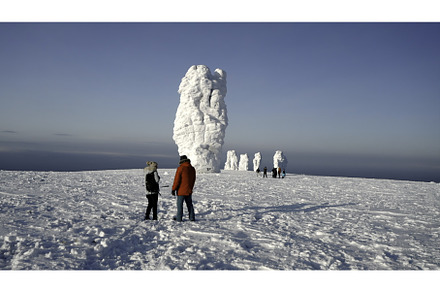 Winter desert with a walking tourist, a Sports & Recreation Photo by Media Whale Stock