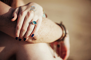 Close up hands with boho accessories containing jewelry, bohemian, and boho