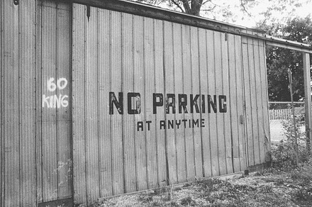 Metal Sliding Door with No Parking, an Industrial Photo by Jamie Pickering