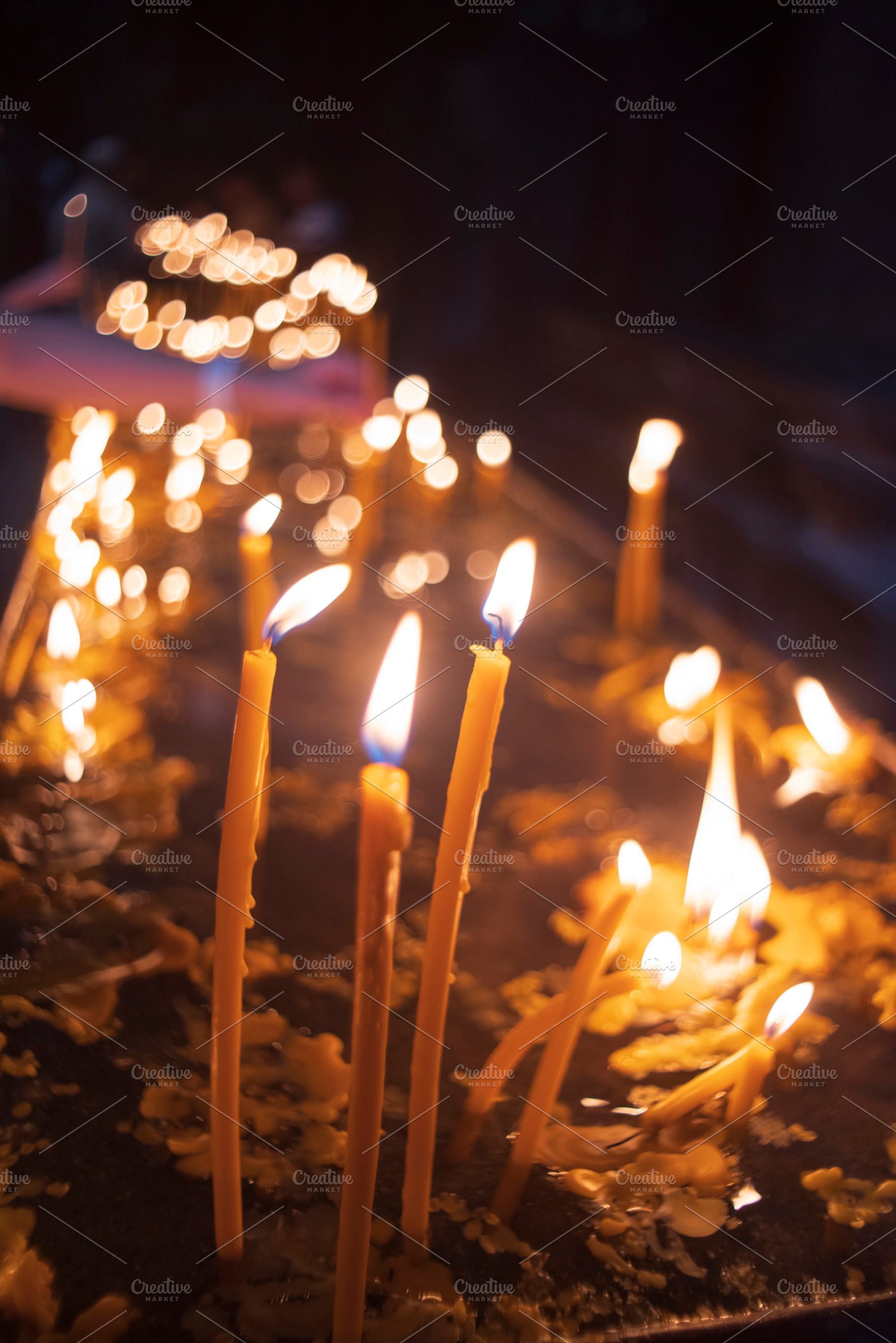 Burning church candles in dark temple with bokeh and copy space, a Photo by Pictures for you!!!!!!!!!