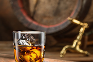 Glass of whiskey on top of wooden, a Food & Drink Photo by Volff