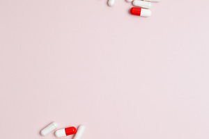 Concept of healthcare and medicine. White bottles container with colorful medic, a Photo by matucha
