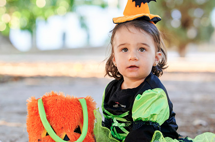Baby in halloween costume outdoors