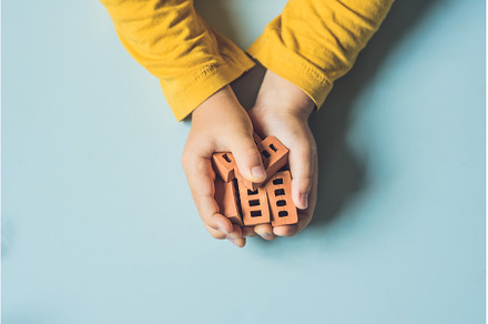 Close up of child's hands playing, an Architecture Photo by Elizaveta Galitskaya