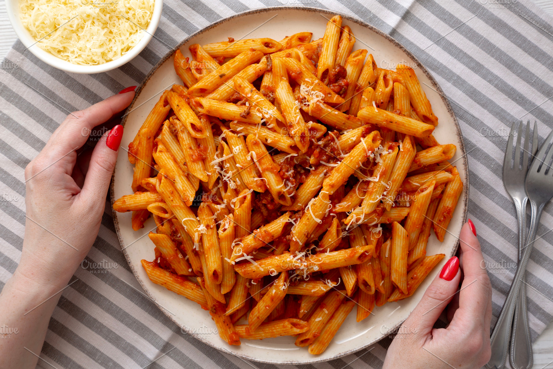 Homemade Pasta Bolognese with Cheese on a Plate, top view., a Food & Drink Photo by LiudmylaChuhunova