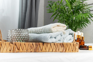 Spa setting with essential oils and soft towels, a Beauty & Fashion Photo by Olena Rudo