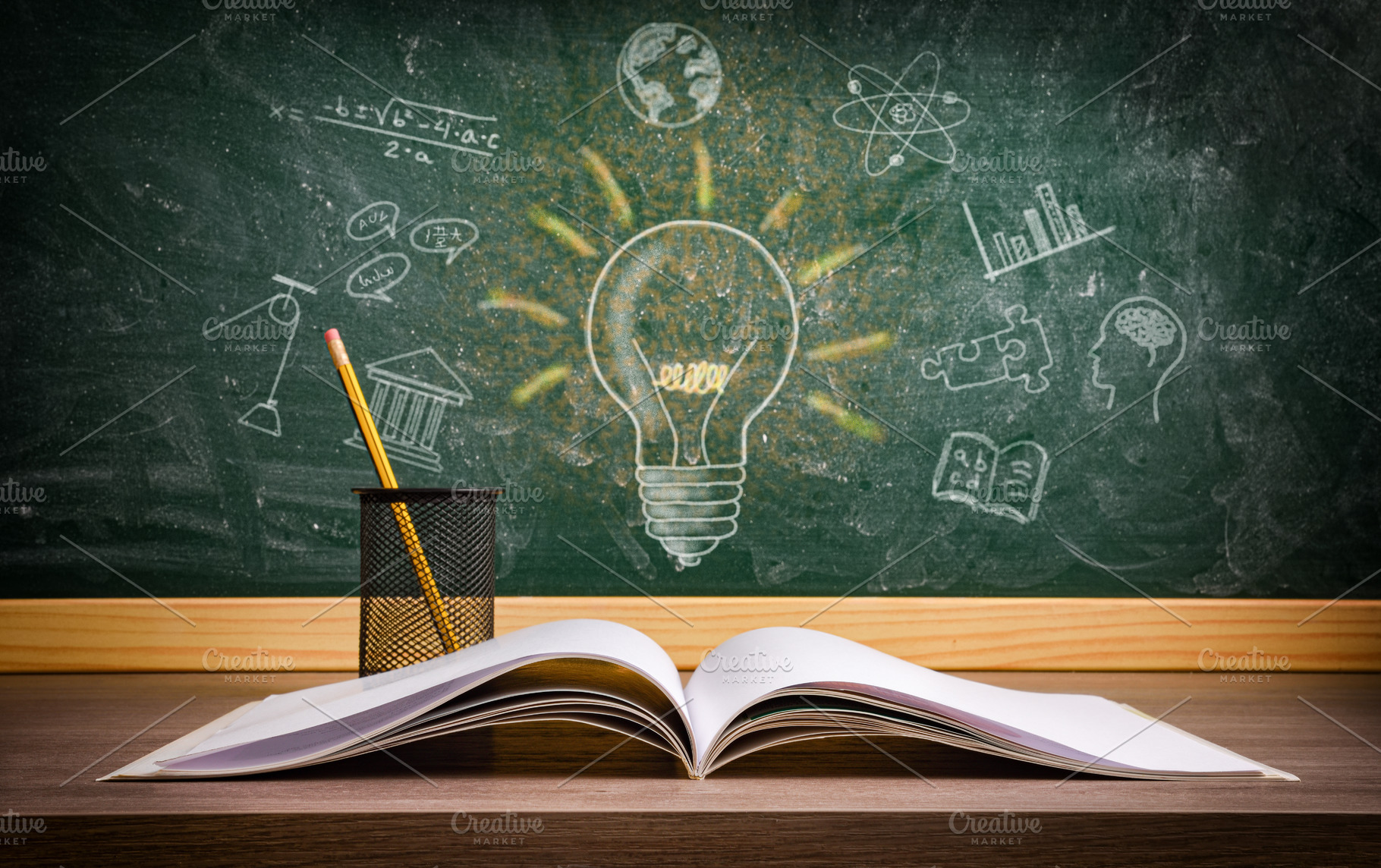 Study in education with book and blackboard with drawings, a Photo by Davizro's Market