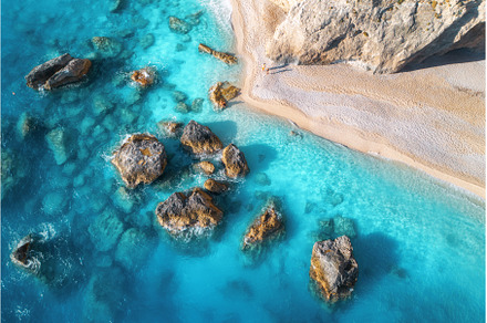 Aerial view of blue sea, rocks in, a Nature Photo by den-belitsky