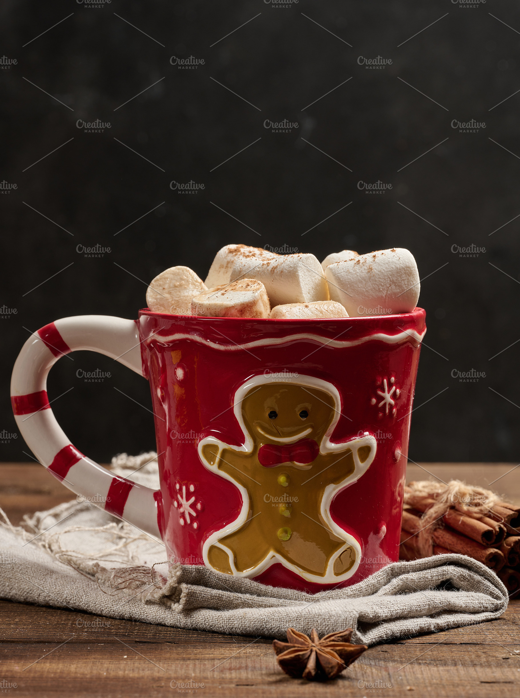 Hot chocolate in a red Christmas mug with a gingerbread man, mar, a Food & Drink Photo by ndanko