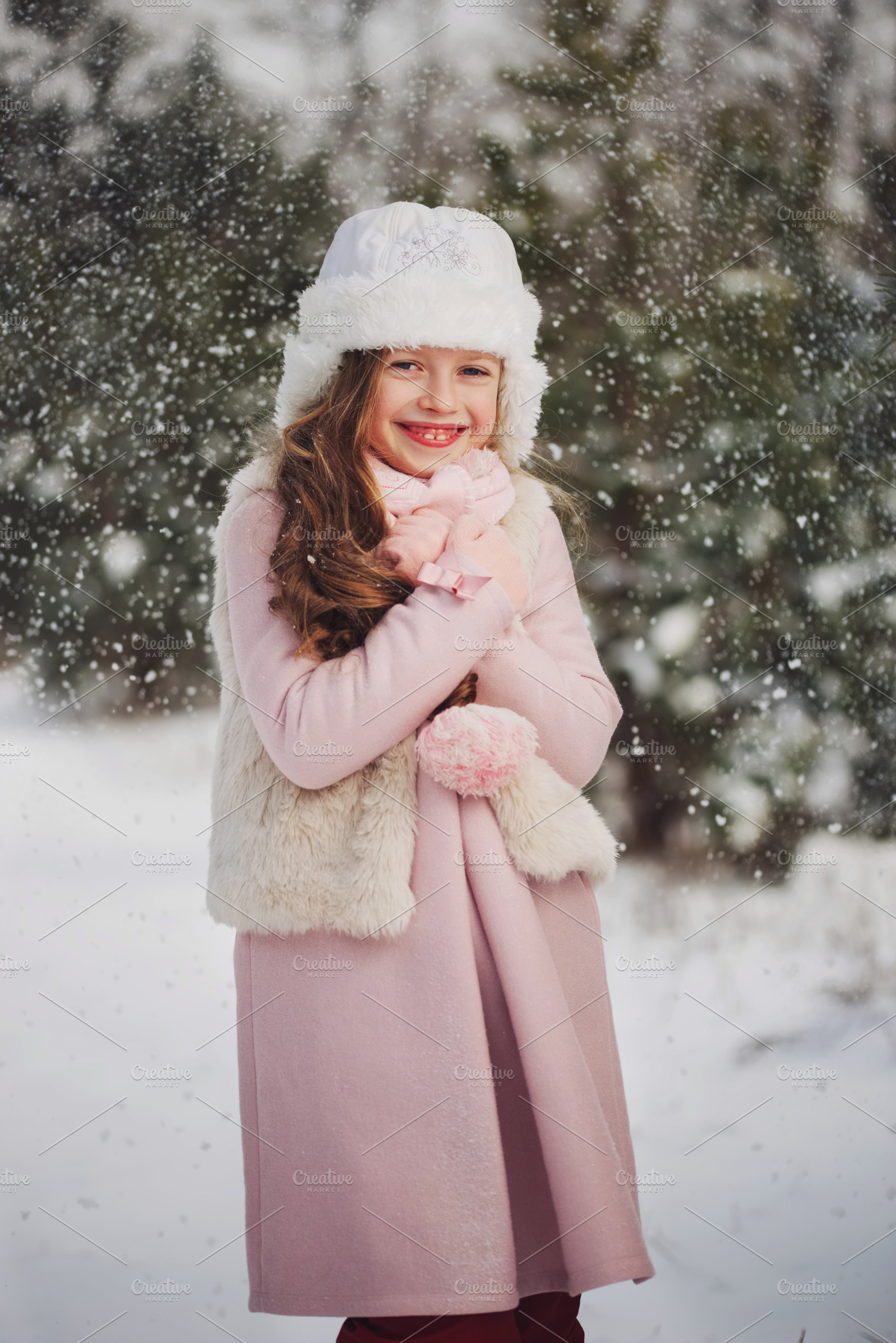 Little happy beautiful girl in stock photo containing winter and snow, a Person Photo by AlohaHawaii