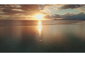 Golden sunset illuminating calm, a Nature Photo by Goinyk