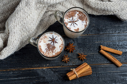 Masala tea on a dark wooden backgrou featuring milk, drink, and cinnamon, a Food & Drink Photo by PavelKant