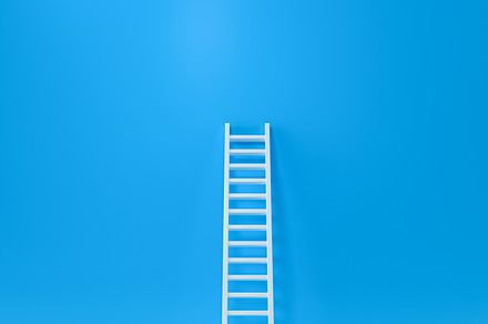 Step ladder on a blue wall, Up, a Business Photo by Zama Studio