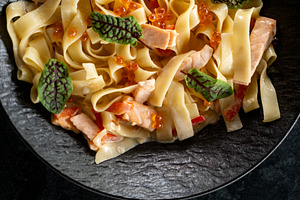Creamy tagliatelle italian cuisine salmon leaves, a Food & Drink Photo by Photo Drive Studio