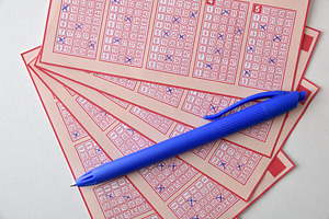 Lottery Tickets and Blue Pen for Number Selection, a Sports & Recreation Photo by Davizro's Market