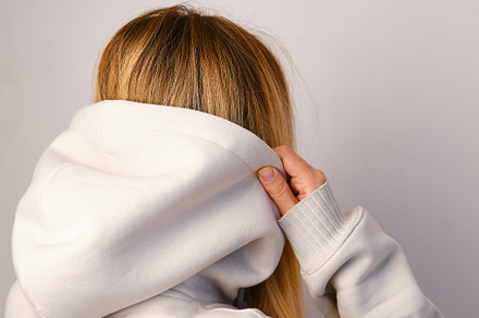 Young beautiful girl in white hoodie, a Person Photo by Iuliia Pilipeichenko