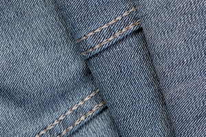 new blue denim fabric for the production of clothing and other items, a Photo by rsoollAI