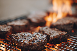 Juicy beef steaks grilling over open, a Food & Drink Photo by MistyDay
