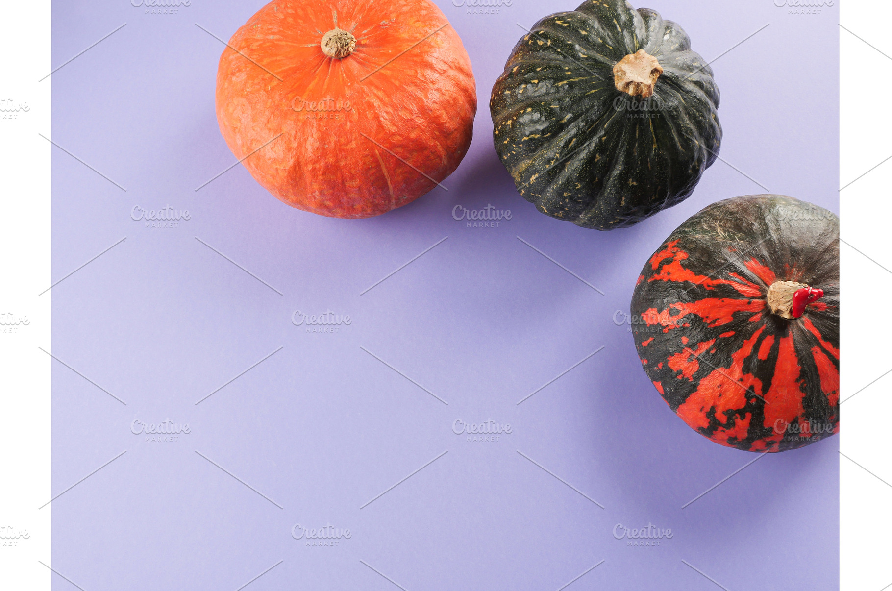 Three colorful pumpkins on purple, a Food & Drink Photo by Lifemorning