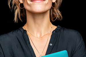 Confident woman holding a laptop, a Person Photo by AlyaAnd