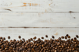 Flat lay of coffee beans with copyspace on wooden table, a Food & Drink Photo by AlyaAnd