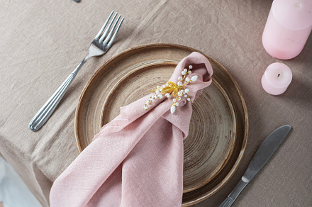 table with linen tablecloth in beige color