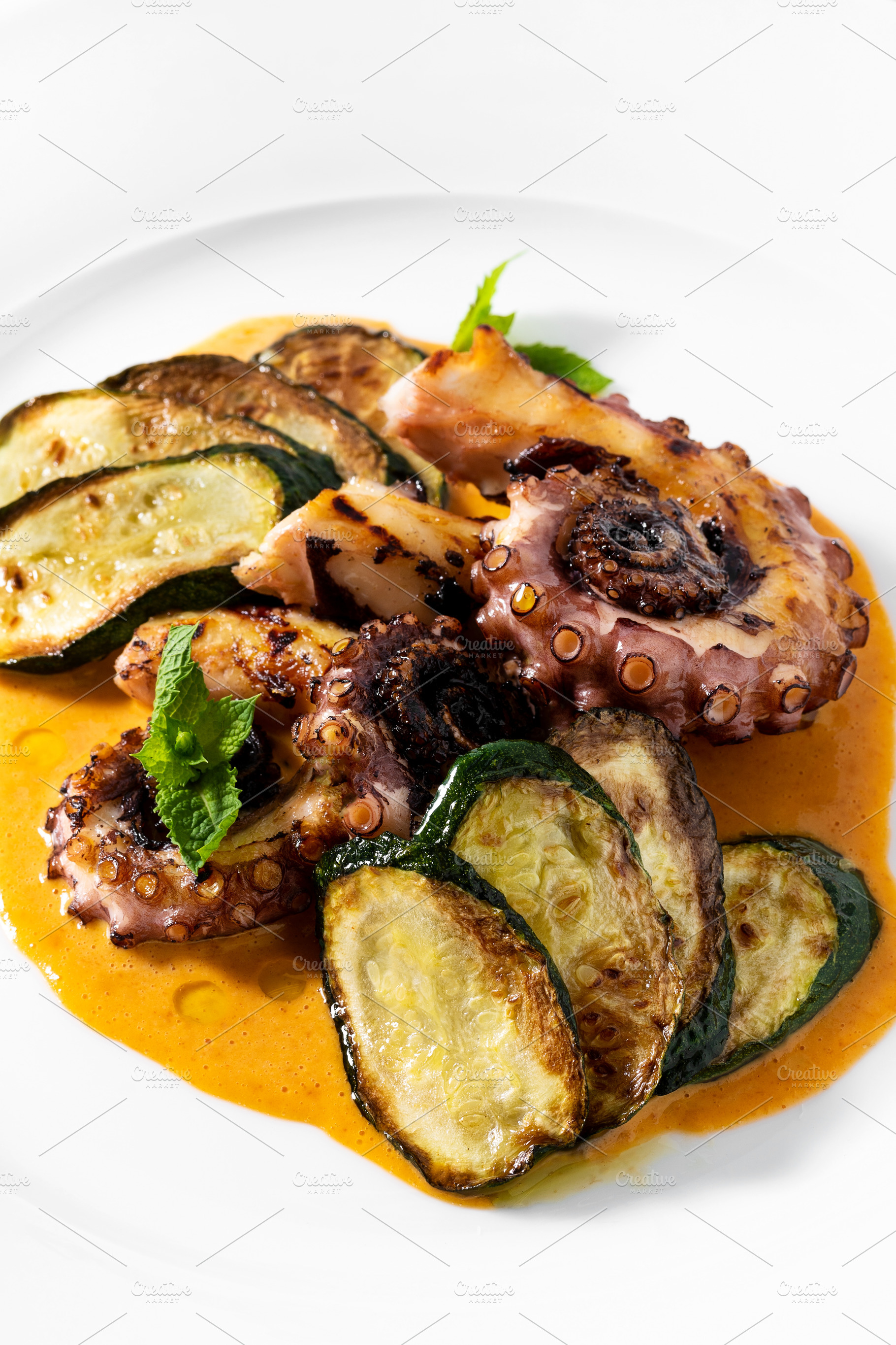cooked octopus, served with courgettes and sauce, a Food & Drink Photo by IriGri