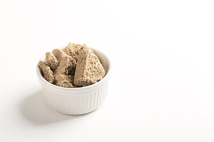 Vegetable-based halva sweet prepared from seeds on white, a Food & Drink Photo by zakiroff