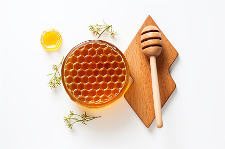 Honeycomb with honey and honey dipper on white background, a Food & Drink Photo by AlyaAnd