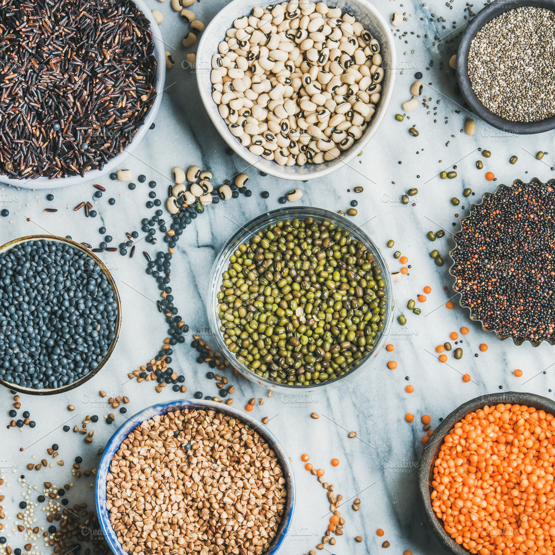 Various raw uncooked grains, beans, a Food & Drink Photo by Foxys
